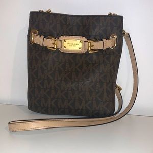 Michael Kors medium sized brown purse with gold accents and shoulder strap